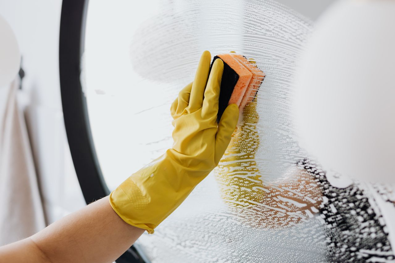 Cleaner performing routine cleaning in a commercial office
